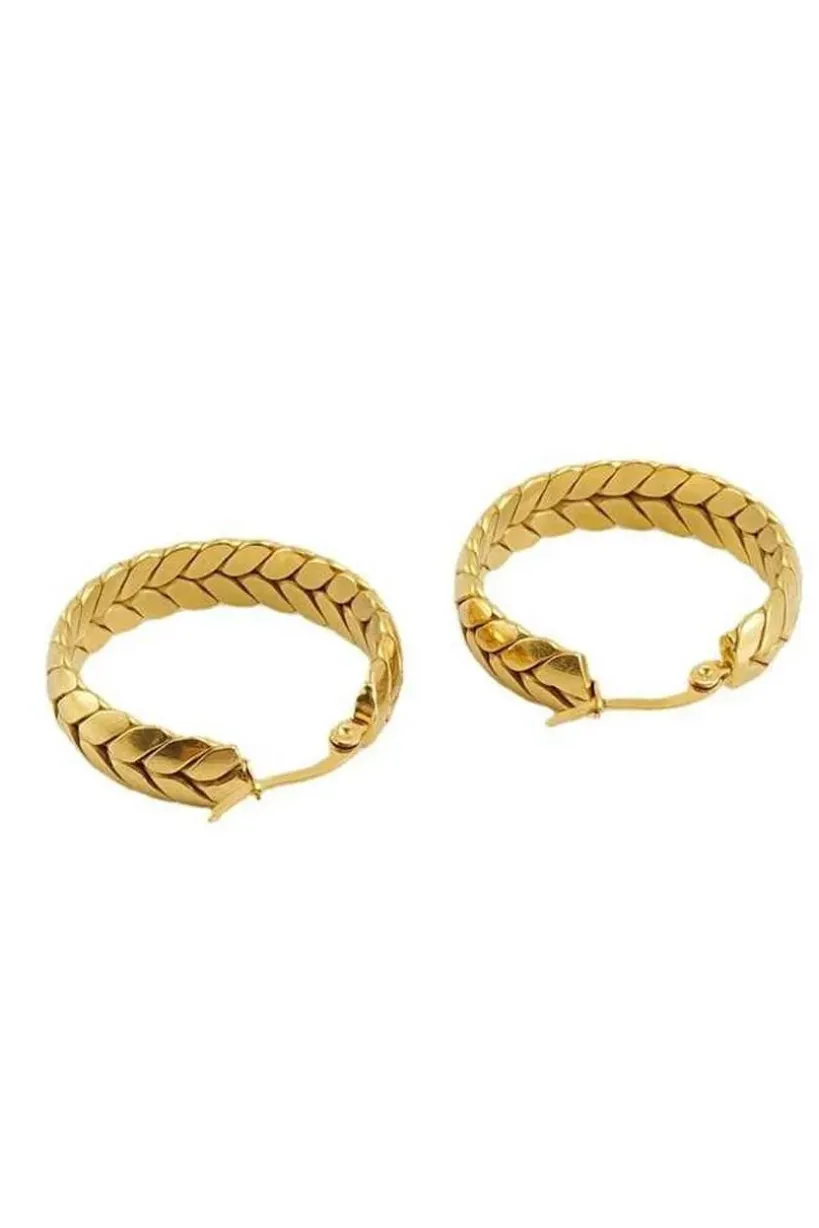 Braided Hoop Earrings In Gold by SVNX