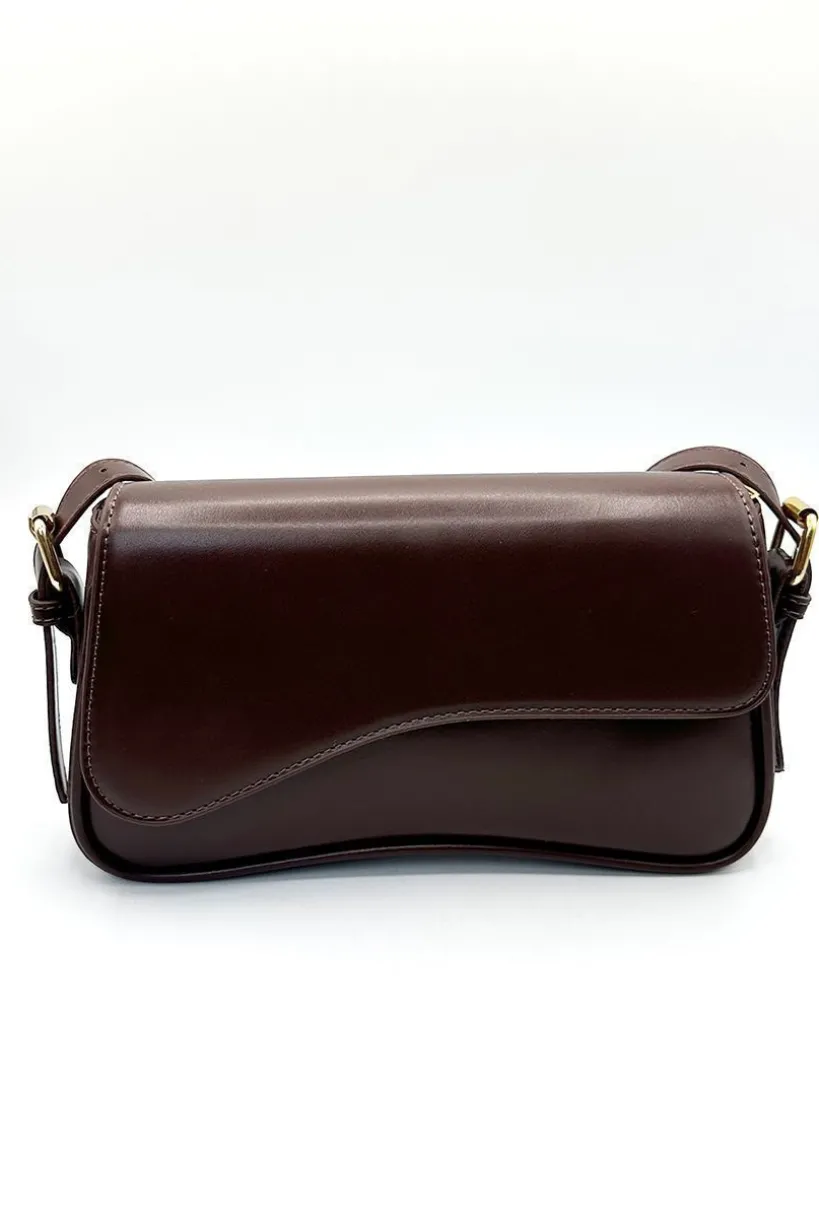 Curved Baguette Bag In Dark Brown by SVNX