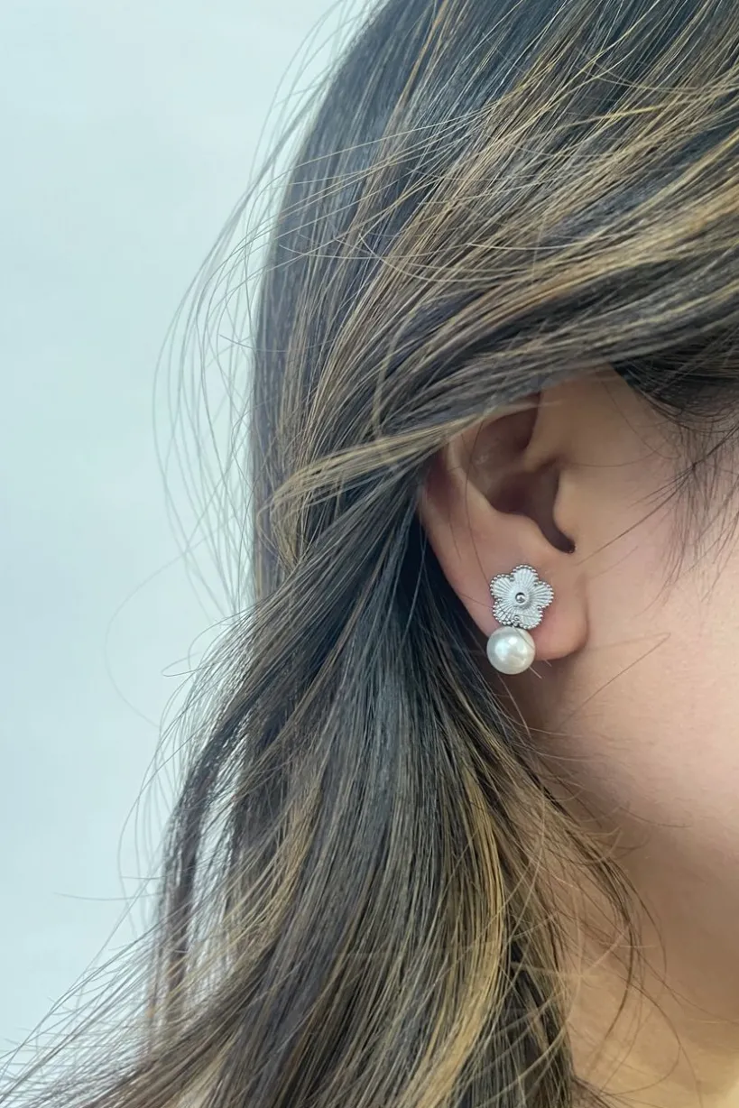 Floral Pearl Stud Earrings In Silver by SVNX