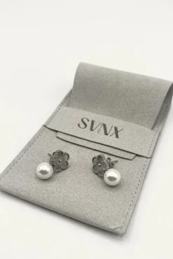 Floral Pearl Stud Earrings In Silver by SVNX