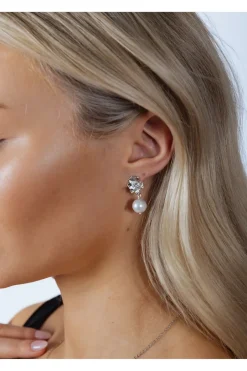 Flower Drop Pearl Earrings In Silver by SVNX