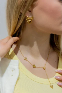Heart Pendant Bow Earring In Gold by Last True Angel