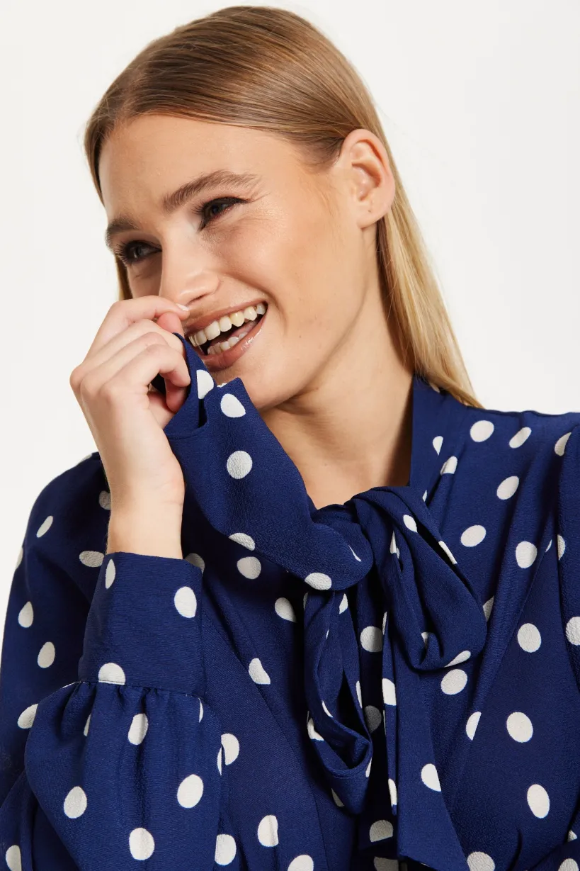 Navy Polka Dot Flared Hem Blouse by Liquorish