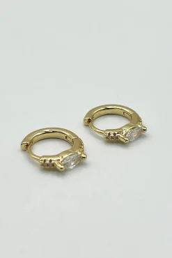 Oval Crystal Huggie Hoops by SVNX