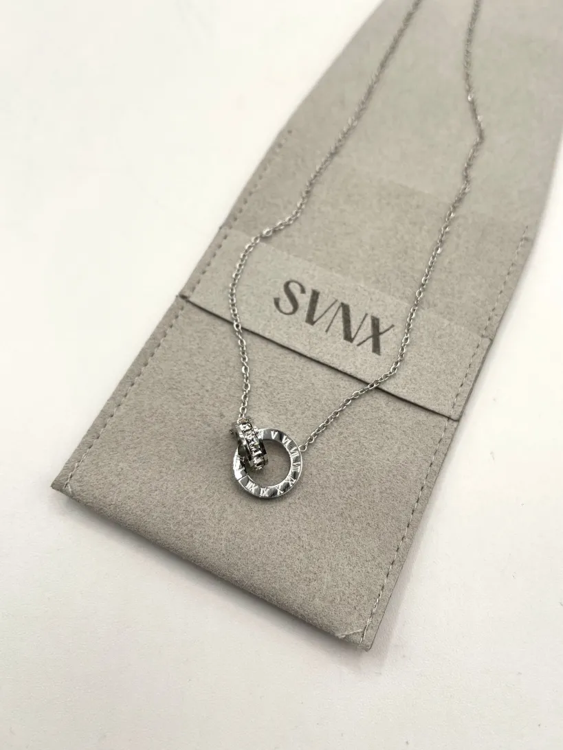 Roman Numeral Necklace In Silver by SVNX