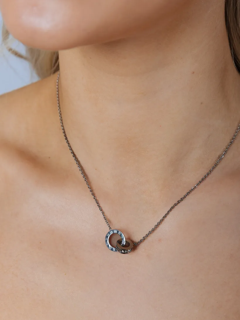 Roman Numeral Necklace In Silver by SVNX